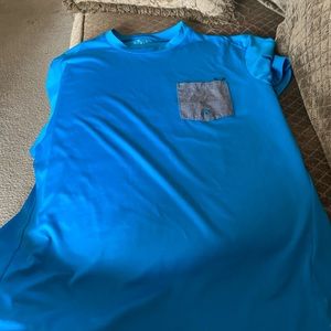 I have a blue X-Large Oakley pocket t-shirt blue. Comes from a smoke free home.